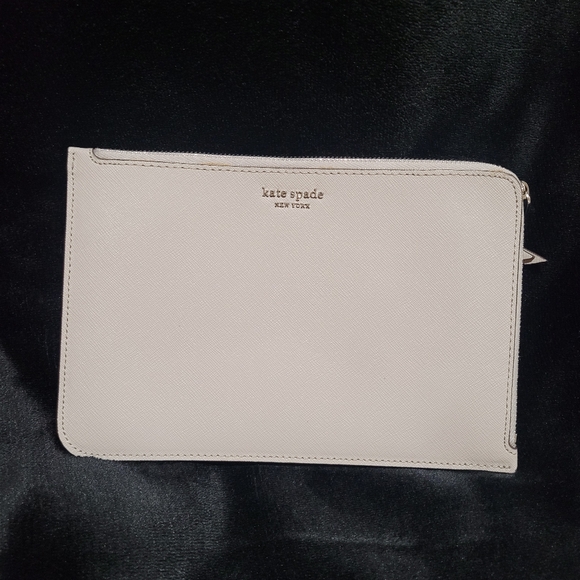 kate spade Handbags - Kate Spade light gray Pouch Wristlet missing strap Like New condition